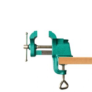 Isolated shot of opend green table vice on white background